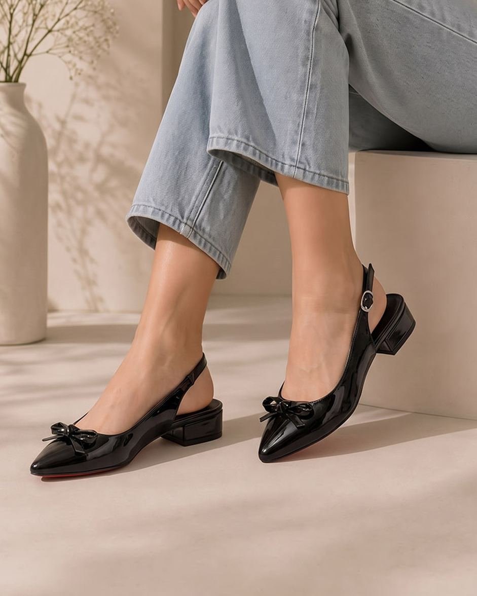 60458 ZAPATILLA DESTALONADA DE TACÓN DELGADO CON MOÑO DECORATIVO Y CORREA AJUSTABLE AL TOBILLO